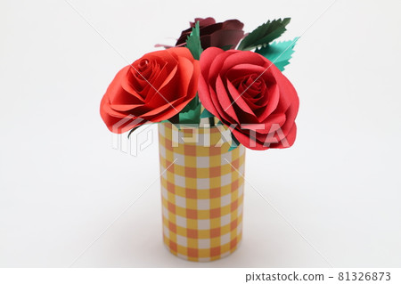 Handmade rose flowers made from origami are displayed in a beautiful vase 81326873