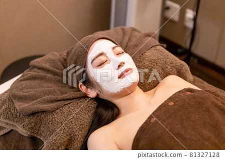 Woman receiving treatment at beauty salon Woman receiving treatment at beauty salon 81327128