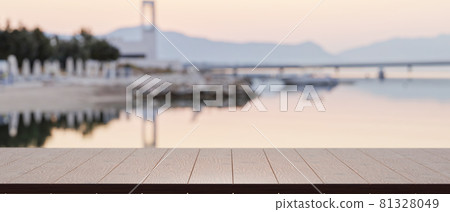 Empty of wood table top for product display with blurred lake harbour view in the background Empty of wood table top for product display with blurred lake harbour view in the background 81328049