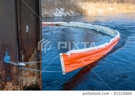 The floating boom prevents foam and debris from contaminating the reservoir. Reducing harmful emissions. Protection of rivers and lakes. Keeping fresh water sources clean. Ecological concept. 81328866