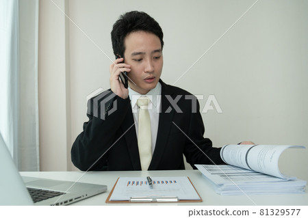 Asian businessman working from home. Asian businessman working from home. 81329577