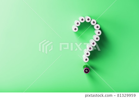 AA batteries in the form of a question mark on a green background with free space AA batteries in the form of a question mark on a green background with free space 81329959