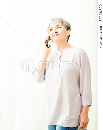 A pleasant conversation with a mature gray-haired woman of Asian descent. A pleasant conversation with a mature gray-haired woman of Asian descent. 81330800