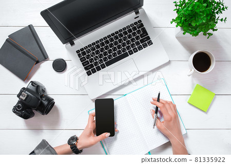 Overhead view of businesswoman working at computer in office 81335922