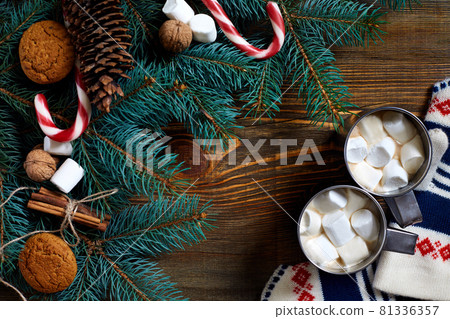 Christmas drink. Mug hot coffee with marshmallow, red candy cane on the wooden background. New Year. Christmas drink. Mug hot coffee with marshmallow, red candy cane on the wooden background. New Year. 81336357