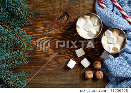 Christmas drink. Mug hot coffee with marshmallow, red candy cane on the wooden background. New Year. Christmas drink. Mug hot coffee with marshmallow, red candy cane on the wooden background. New Year. 81336408