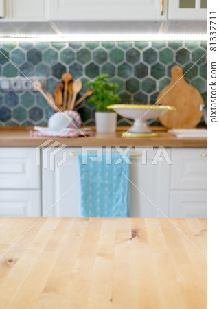 blurred kitchen interior and wooden desk space home background blurred kitchen interior and wooden desk space home background 81337711