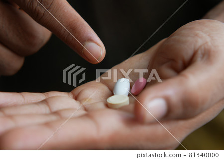close up of medical pills on palm of hand close up of medical pills on palm of hand 81340000