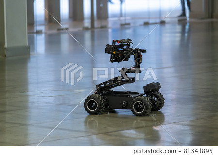 Unmanned vehicle with camera driving on floor 81341895