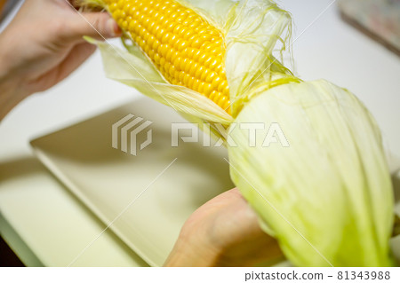 Woman eating corn Woman eating corn 81343988