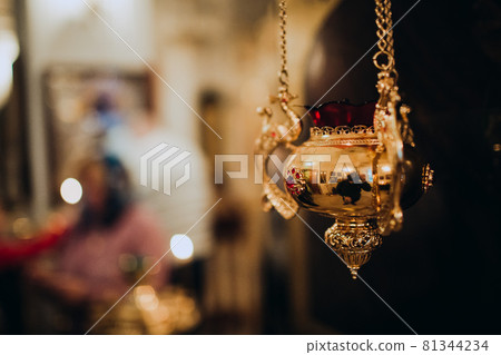 Orthodox Christian golden utensils with incense in the church. Orthodox Christian golden utensils with incense in the church. 81344234