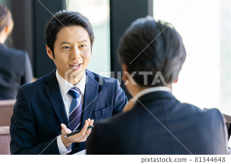 Business man having business talk in office 81344648