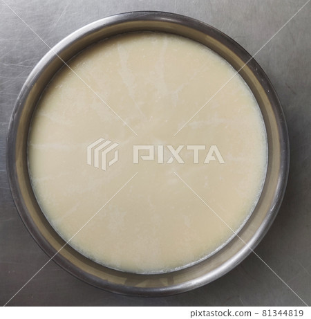 solid oil in stainless deep fryer pot, industrial cooking wax, special oil to fry Doughnut, advertising backgrounds 81344819