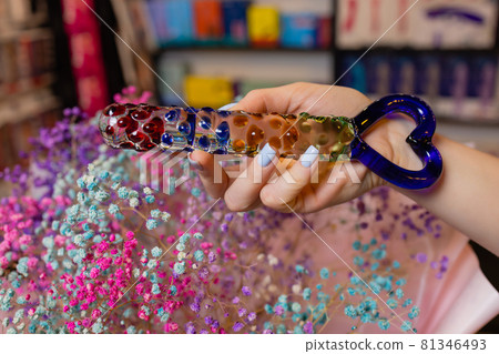 Anal glass butt plug with a fluffy tail with female hands. Toy for adult games. Anal glass butt plug with a fluffy tail with female hands. Toy for adult games. 81346493