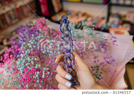 Anal glass butt plug with a fluffy tail with female hands. Toy for adult games. Anal glass butt plug with a fluffy tail with female hands. Toy for adult games. 81346557