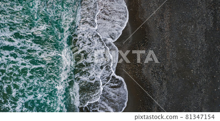 Sea shore with dramatic texture of breaking waves and black sand, drone view Sea shore with dramatic texture of breaking waves and black sand, drone view 81347154