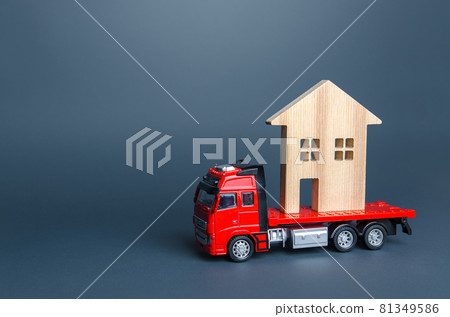 Red truck transports the residence house. Delivery services to another house. A moving company. Transportation of real estate. Resettlement program for new housing. Building insurance. Red truck transports the residence house. Delivery services to another house. A moving company. Transportation of real estate. Resettlement program for new housing. Building insurance. 81349586
