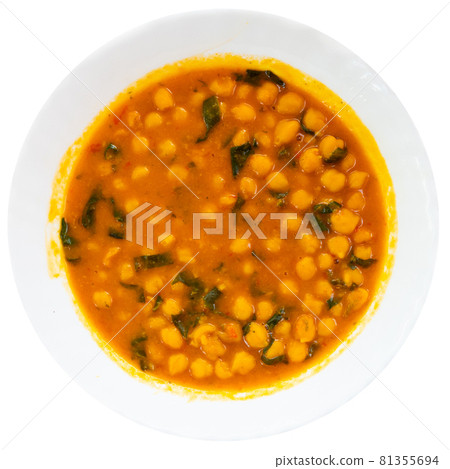 Stewed curried chickpeas with spinach on white plate Stewed curried chickpeas with spinach on white plate 81355694