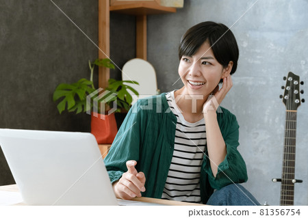 A woman heading to a computer 81356754
