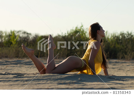 Sensual stylish young female traveler relaxing on beach Sensual stylish young female traveler relaxing on beach 81358343