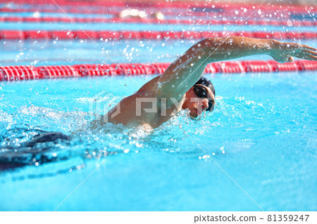 Triathlon fitness athlete man training cardio swimming in outdoor pool at stadium. Swimmer man swmming in blue water . Sport and fitness exercise Triathlon fitness athlete man training cardio swimming in outdoor pool at stadium. Swimmer man swmming in blue water . Sport and fitness exercise 81359247