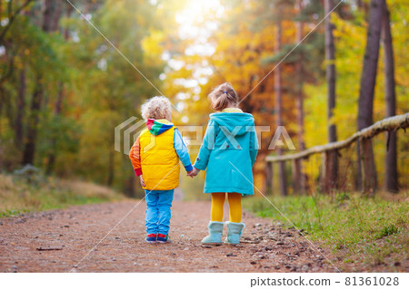 Kids play in autumn park. Children in fall. Kids play in autumn park. Children in fall. 81361028