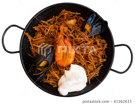 Paella with fideua, pasta noodles and seafood Paella with fideua, pasta noodles and seafood 81362615
