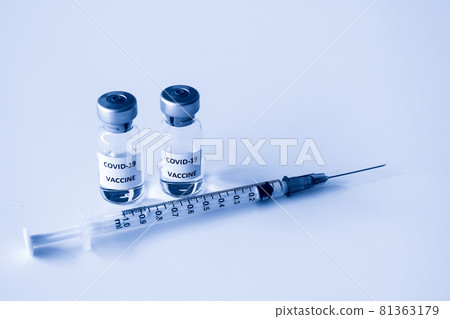 Vial of Covid-19 vaccine and 1 ml plastic syringe with needle isolated on the white background 81363179