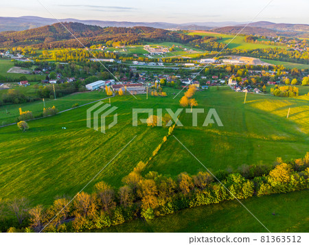 Green rural landscape of Northern Bohemia at susnet time. Aerial view from drone. 81363512