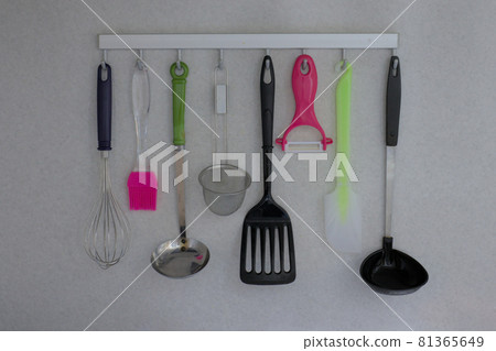 Kitchen utensils hung on a wall slide bar Kitchen utensils hung on a wall slide bar 81365649
