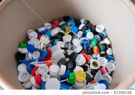 A close-up of many plastic bottle caps collected for recycling. A close-up of many plastic bottle caps collected for recycling. 81366288