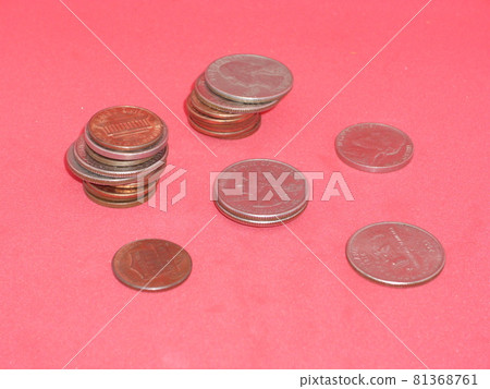Metal coins money USA on red background Metal coins money USA on red background 81368761