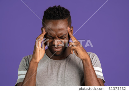 Portrait of African-american young man isolated on purple color studio background. Concept of human emotions, facial expression, youth, feelings, ad. Portrait of African-american young man isolated on purple color studio background. Concept of human emotions, facial expression, youth, feelings, ad. 81373282