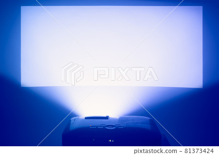 projector in action with illuminated warm blue screen 81373424