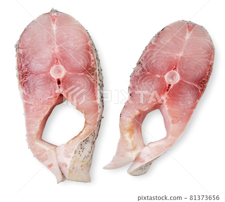Pieces of fish portioned on a white background, isolated. Top view 81373656