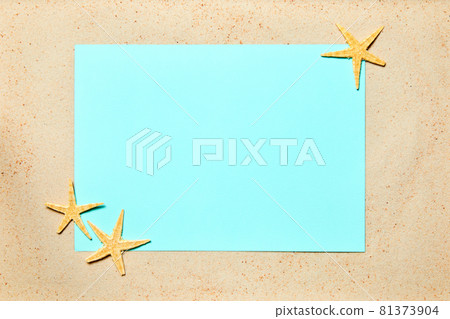 Summer background of sand decorated with starfish and blue copy space Summer background of sand decorated with starfish and blue copy space 81373904