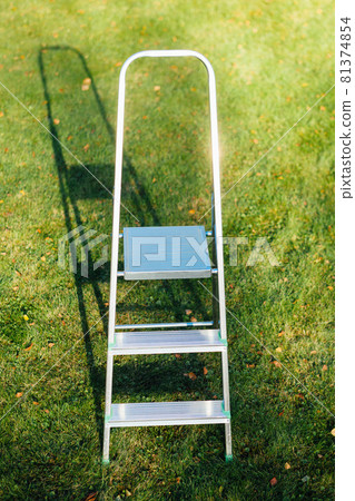 ladder on green lawn background ladder on green lawn background 81374854