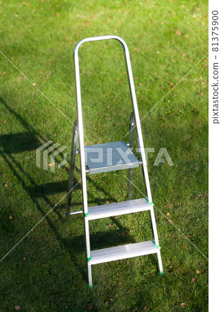 ladder on green lawn background 81375900