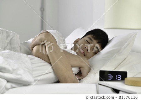 Handsome Young Asian man sleeping in bed Handsome Young Asian man sleeping in bed 81376116