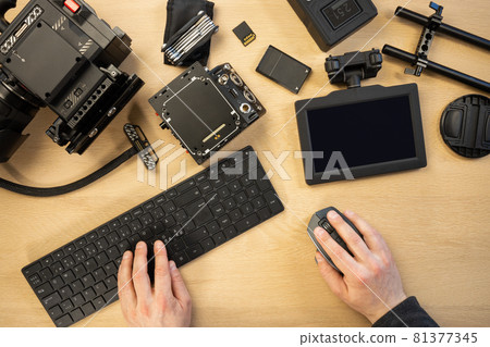 Creative photographer using computer parts by equipment at table 81377345