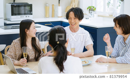 Young men and women having an online drinking party 81379954