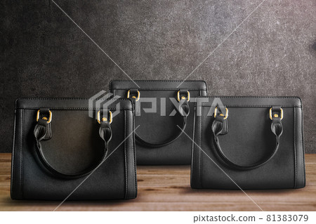 Concrete background and cool black bag Concrete background and cool black bag 81383079
