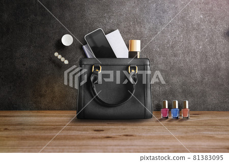 Concrete background and cool black bag contents Concrete background and cool black bag contents 81383095
