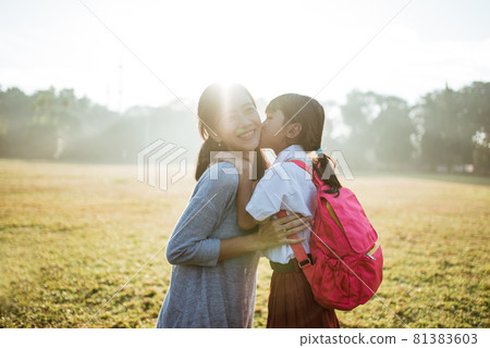 mother taking her daughter to school in the morning mother taking her daughter to school in the morning 81383603