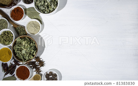 Indian curry spice background, paprika, turmeric, curry leaf, cardamom, star anise, chili etc. 81383830