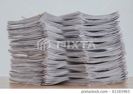 Stack of business paper on wooden desk, job interview and busy business concepts, Document pile on office desk, Overload work, Hard work, pile of papers. Stack of business paper on wooden desk, job interview and busy business concepts, Document pile on office desk, Overload work, Hard work, pile of papers. 81383963