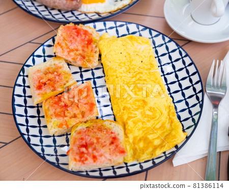 Healthy omelet and sweet jam sandwiches 81386114