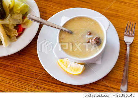 Turkish soup Paca corbasi served with pickle vegetables Turkish soup Paca corbasi served with pickle vegetables 81386143