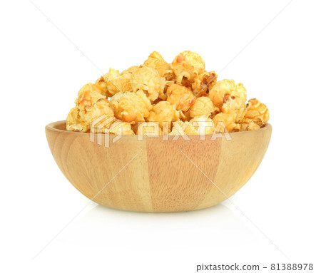 Popcorn in wooden bowl isolated on white background 81388978