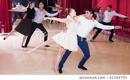 Group of people dancing samba in couple Group of people dancing samba in couple 81389793